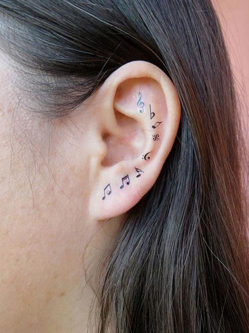hình xăm dòng kẻ và nốt nhạc 